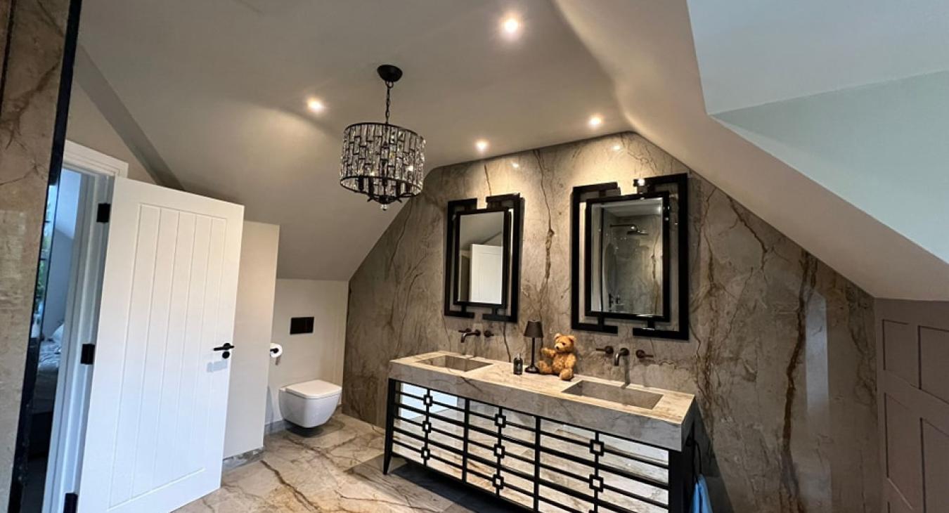 Master en suite bathroom with feature mirrors and lighting